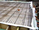 RC foundation slab with thermal insulation and PVC foil under the base plate